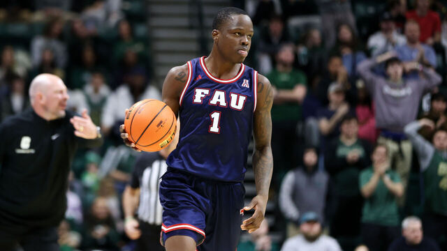 CHARLOTTE, NORTH CAROLINA - JANUARY 6: Johnell Davis #1 of the Florida Atlantic Owls moves the ball against the Charlotte 49ers at Dale F. Halton Arena on January 6, 2024 in Charlotte, North Carolina.
