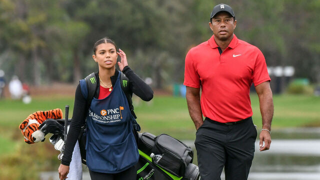 ORLANDO, FLORIDA, UNITED STATES - 2023/12/17: Tiger Woods and his daughter, Sam Woods, arrive at the 18th green during the final round of the PNC Championship at the Ritz-Carlton Golf Club in Orlando, Florida. Bernhard Langer, and his son, Jason Langer won the 2023 PNC Championship.