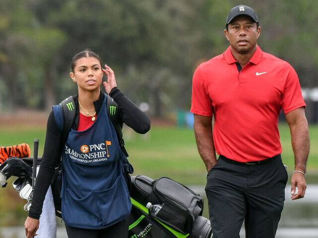 ORLANDO, FLORIDA, UNITED STATES - 2023/12/17: Tiger Woods and his daughter, Sam Woods, arrive at the 18th green during the final round of the PNC Championship at the Ritz-Carlton Golf Club in Orlando, Florida. Bernhard Langer, and his son, Jason Langer won the 2023 PNC Championship.