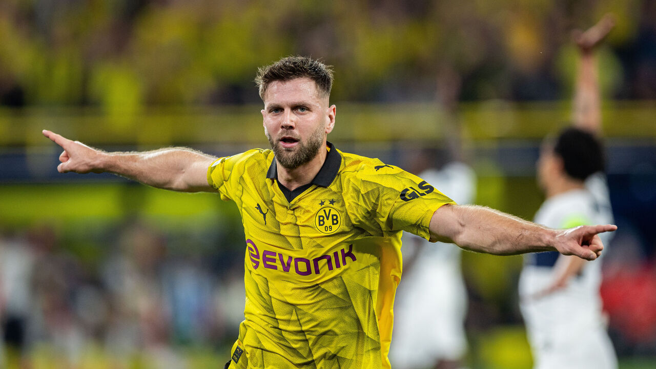 DORTMUND, GERMANY - MAY 01: Sebastian Haller of Borussia Dortmund celebrates after scoring his team's first goal during the UEFA Champions League semi-final first leg match between Borussia Dortmund and Paris Saint-Germain at Signal Iduna Park on May 01, 2024 in Dortmund, Germany.