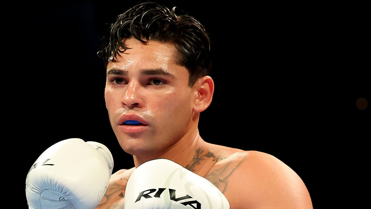 NEW YORK, NEW YORK - APRIL 20: Ryan Garcia (white trunks) prepares to fight Devin Haney during their WBC Super Lightweight title bout at Barclays Center on April 20, 2024 in New York City.