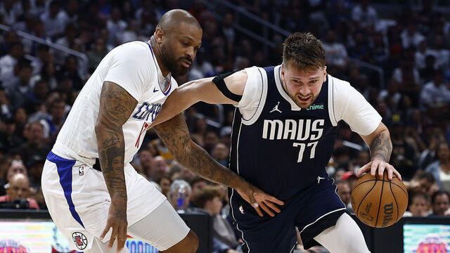 LOS ANGELES, CALIFORNIA - MAY 01: Luka Doncic #77 of the Dallas Mavericks controls the ball against P.J. Tucker #17 of the LA Clippers in the second half during game five of the Western Conference First Round Playoffs at Crypto.com Arena on May 01, 2024 in Los Angeles, California. NOTE TO USER: User expressly acknowledges and agrees that, by downloading and/or using this photograph, user is consenting to the terms and conditions of the Getty Images License Agreement.