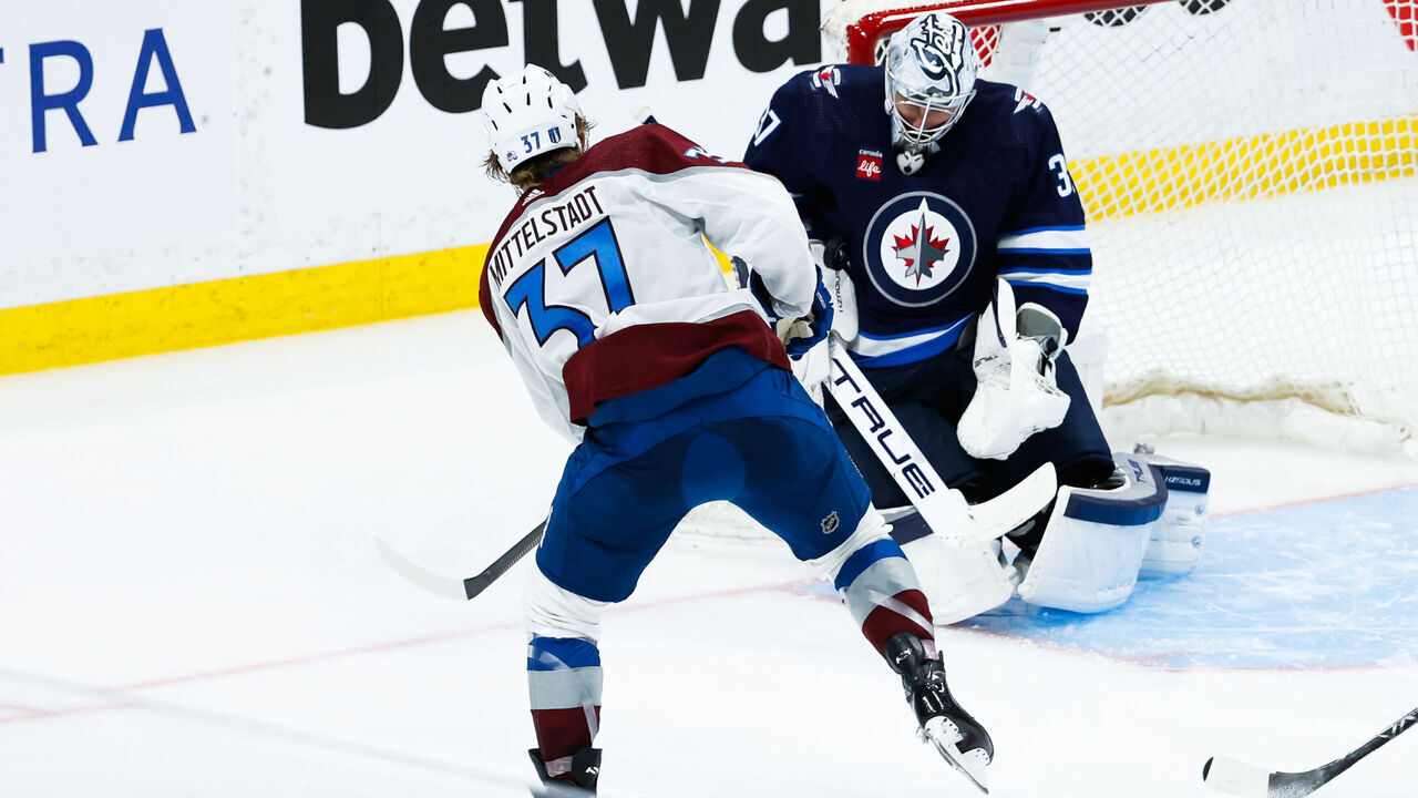 WINNIPEG, MB - APRIL 21: Winnipeg Jets goalie Connor Hellebuyck (37) makes a save on a shot by Colorado Avalanche forward Carey Mittelstadt (37) during the Western Conference First Round game between the Winnipeg Jets and the Colorado Avalanche on April 21, 2024 at the Canada Life Centre in Winnipeg MB. by Terrence Lee/Icon Sportswire via Getty Images)