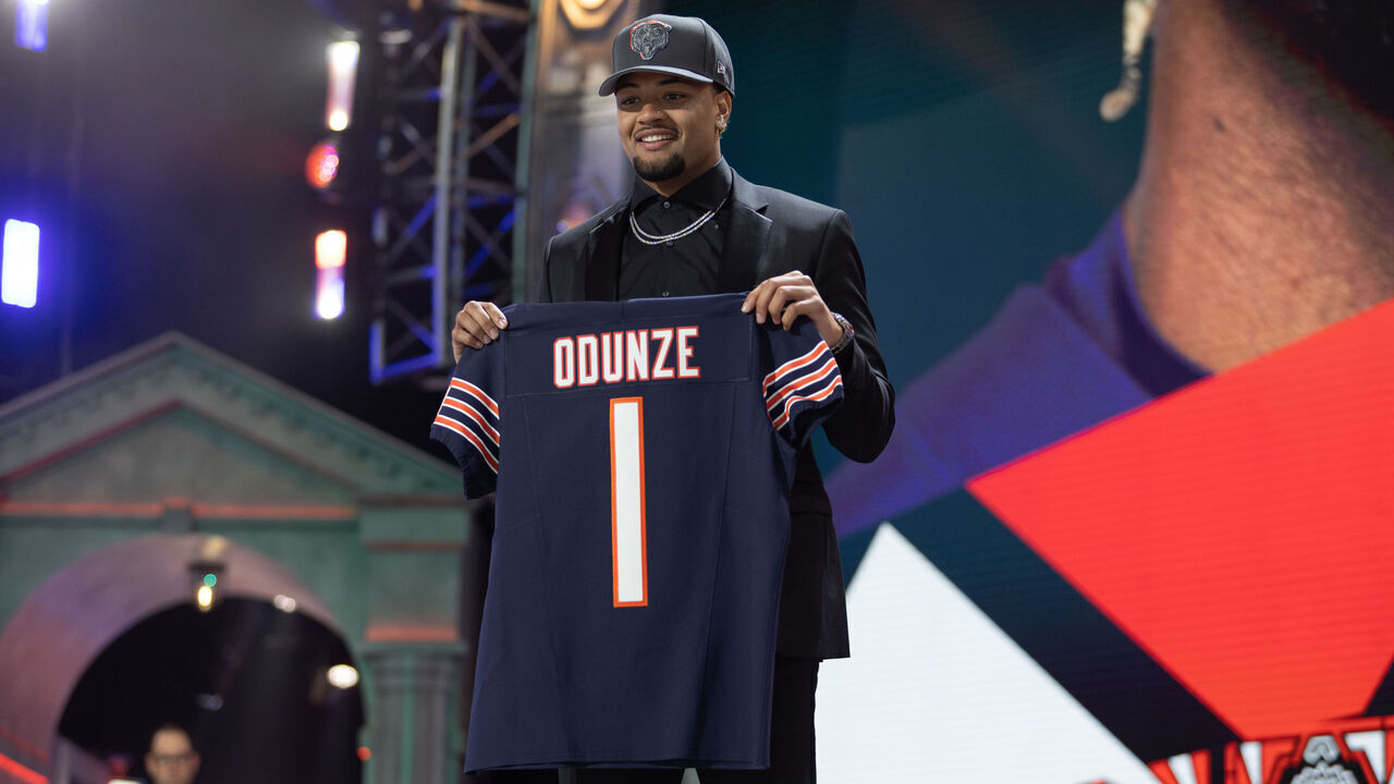 DETROIT, MI - APRIL 25: Washington Wide Receiver Rome Odunze holds a jersey on stage after being taken ninth overall by the Chicago Bears during Day 1 of the NFL Draft on April 25, 2024 at Campus Martius Park and Hart Plaza in Detroit, MI.