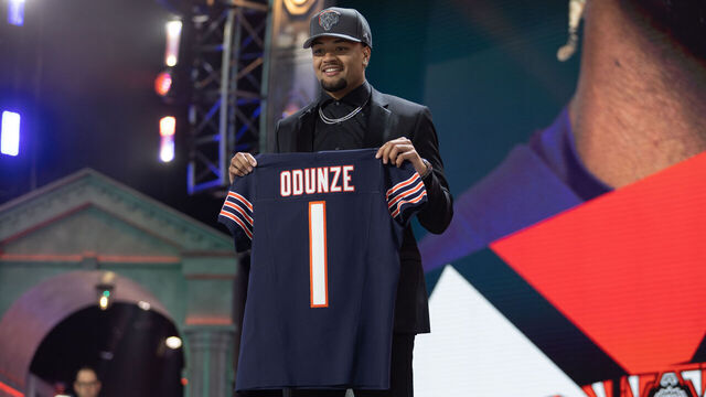 DETROIT, MI - APRIL 25: Washington Wide Receiver Rome Odunze holds a jersey on stage after being taken ninth overall by the Chicago Bears during Day 1 of the NFL Draft on April 25, 2024 at Campus Martius Park and Hart Plaza in Detroit, MI.