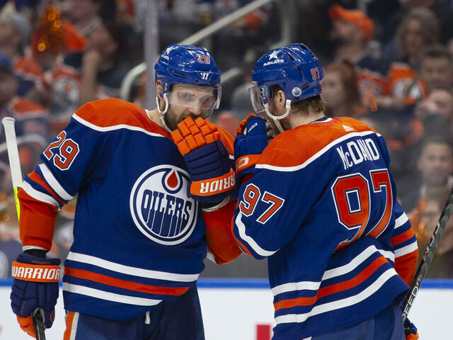 EDMONTON, CANADA - APRIL 22: Leon Draisaitl #29 and Connor McDavid #97 of the Edmonton Oilers strategize against the Los Angeles Kings during the second period in Game One of the First Round of the 2024 Stanley Cup Playoffs at Rogers Place on April 22, 2024, in Edmonton, Canada.