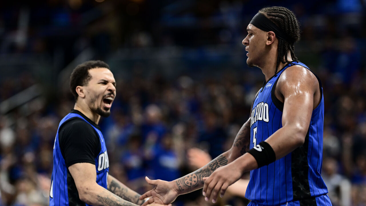 ORLANDO, FLORIDA - MAY 03: Paolo Banchero #5 of the Orlando Magic celebrates with Cole Anthony #50 of the Orlando Magic against the Cleveland Cavaliers during the first quarter in Game Six of the Eastern Conference First Round Playoffs at Kia Center on May 03, 2024 in Orlando, Florida.