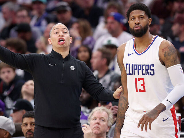 SACRAMENTO, CALIFORNIA - APRIL 02: LA Clippers head coach Tyronn Lue shouts to his team while standing next to Paul George #13 during their game against the Sacramento Kings in the first half at Golden 1 Center on April 02, 2024 in Sacramento, California.