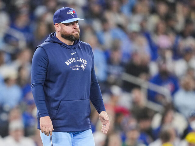 TORONTO, ON - APRIL 28: John Schneider manager of Toronto Blue Jays walks to the mound in a break in play against the Los Angeles Dodgers in their MLB game at the Rogers Centre on April 28, 2024 in Toronto, Ontario, Canada.