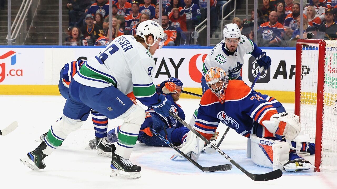 EDMONTON, CANADA - APRIL 13: Stuart Skinner #74 of the Edmonton Oilers stops Brock Boeser #6 of the Vancouver Canucks in the third period at Rogers Place on April 13, 2024 in Edmonton, Alberta, Canada.