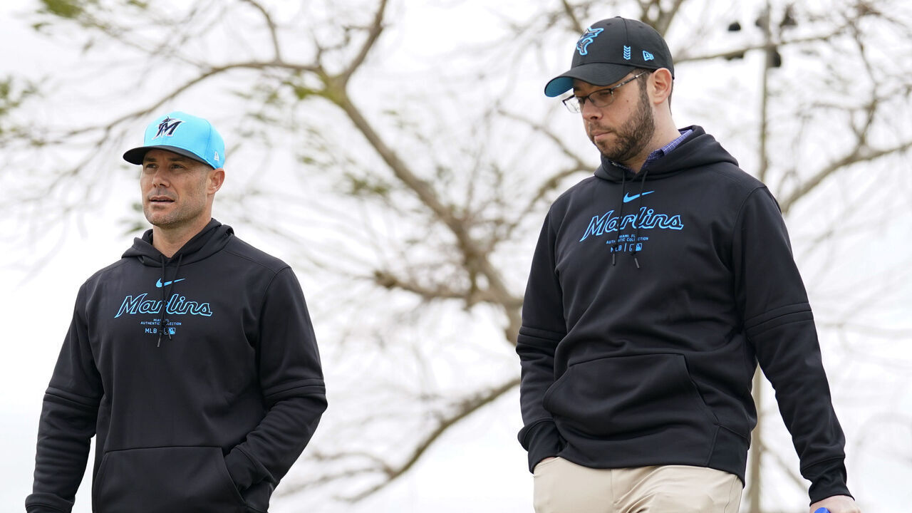 JUPITER, FLORIDA - FEBRUARY 19: Miami Marlins Manager Skip Schumaker and Director Of Baseball Operations Peter Bendix walk through the training ground at Roger Dean Stadium on February 19, 2024 in Jupiter, Florida.