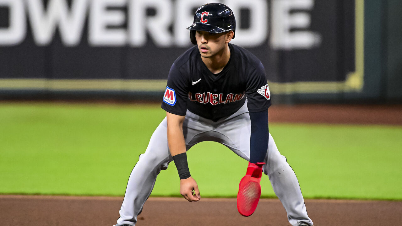 HOUSTON, TEXAS - APRIL 30: Steven Kwan #38 of the Cleveland Guardians leads off first base against the Houston Astros at Minute Maid Park on April 30, 2024 in Houston, Texas.