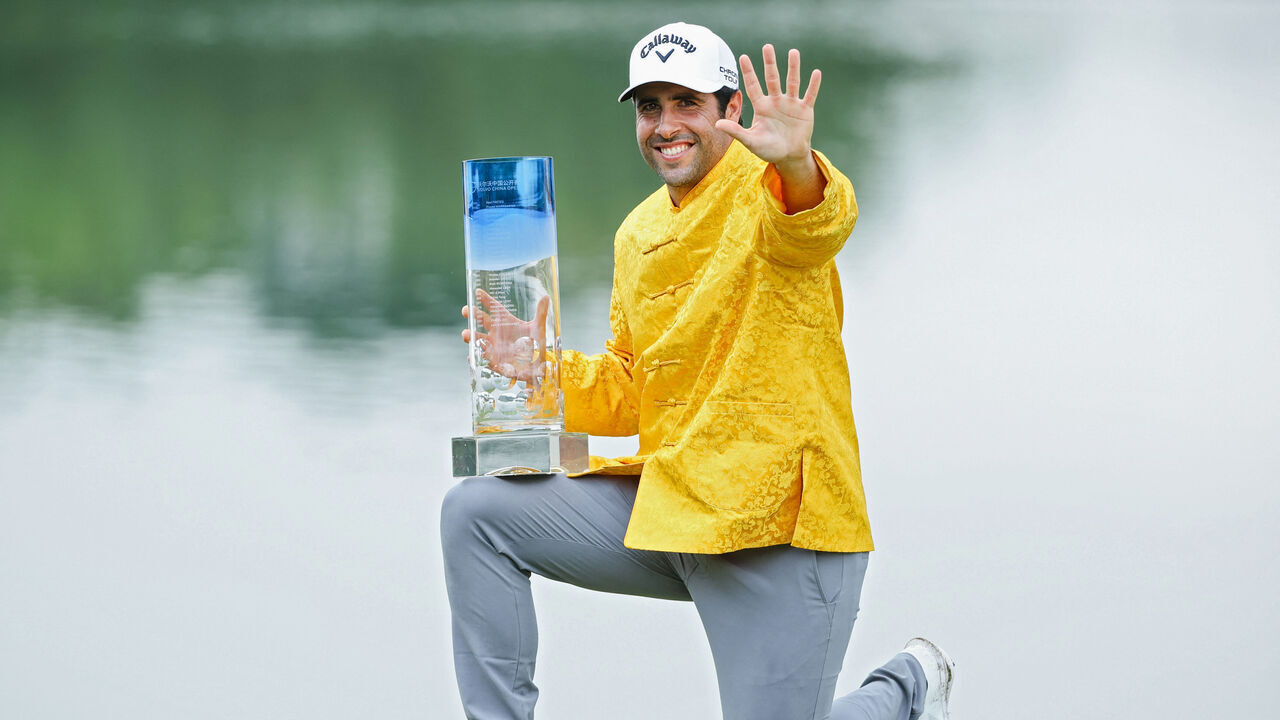 Spain's Adrian Otaegui celebrates with the trophy after winning the China Open Golf tournament in Shenzhen, in southern China's Guangdong province on May 5, 2024.