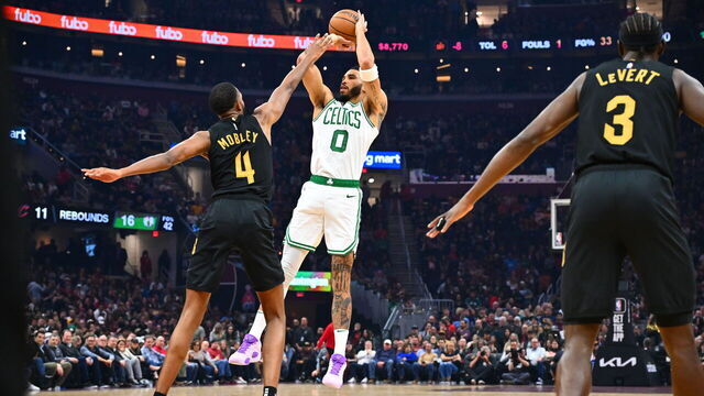 CLEVELAND, OHIO - MARCH 05: Jayson Tatum #0 of the Boston Celtics shoots over Evan Mobley #4 of the Cleveland Cavaliers during the first half at Rocket Mortgage Fieldhouse on March 05, 2024 in Cleveland, Ohio.