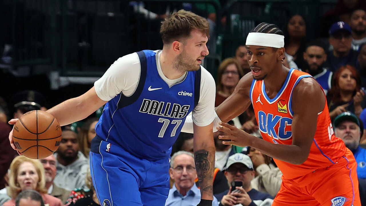 DALLAS, TEXAS - DECEMBER 02: Luka Doncic #77 of the Dallas Mavericks looks for an opening against Shai Gilgeous-Alexander #2 of the Oklahoma City Thunder at American Airlines Center on December 02, 2023 in Dallas, Texas.