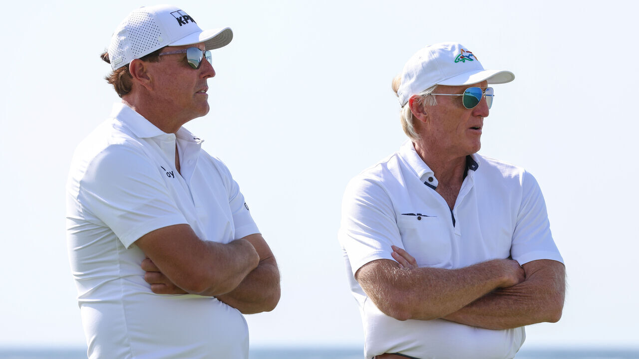 AL MUROOJ, SAUDI ARABIA - FEBRUARY 02: Phil Mickelson of USA and Greg Norman, CEO of Liv Golf Investments interact during a practice round prior to the PIF Saudi International at Royal Greens Golf & Country Club on February 02, 2022 in Al Murooj, Saudi Arabia.