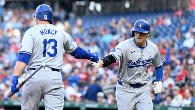 WASHINGTON, DC - APRIL 24: Shohei Ohtani #17 of the Los Angeles Dodgers celebrates with Max Muncy #13 after scoring in the first inning against the Washington Nationals at Nationals Park on April 24, 2024 in Washington, DC.