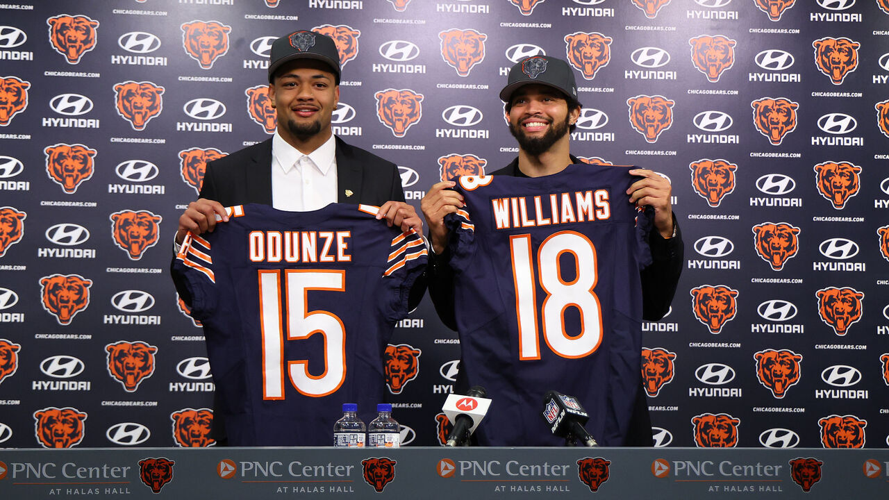 LAKE FOREST, ILLINOIS - APRIL 26: Rome Odunze #15 and Caleb Williams #18 of the Chicago Bears pose for a photo during their introductory press conference at Halas Hall on April 26, 2024 in Lake Forest, Illinois. Caleb Williams was selected first overall and Rome Odunze was selected ninth overall in the first round of the 2024 NFL Draft Thursday.
