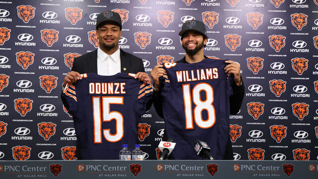 LAKE FOREST, ILLINOIS - APRIL 26: Rome Odunze #15 and Caleb Williams #18 of the Chicago Bears pose for a photo during their introductory press conference at Halas Hall on April 26, 2024 in Lake Forest, Illinois. Caleb Williams was selected first overall and Rome Odunze was selected ninth overall in the first round of the 2024 NFL Draft Thursday.