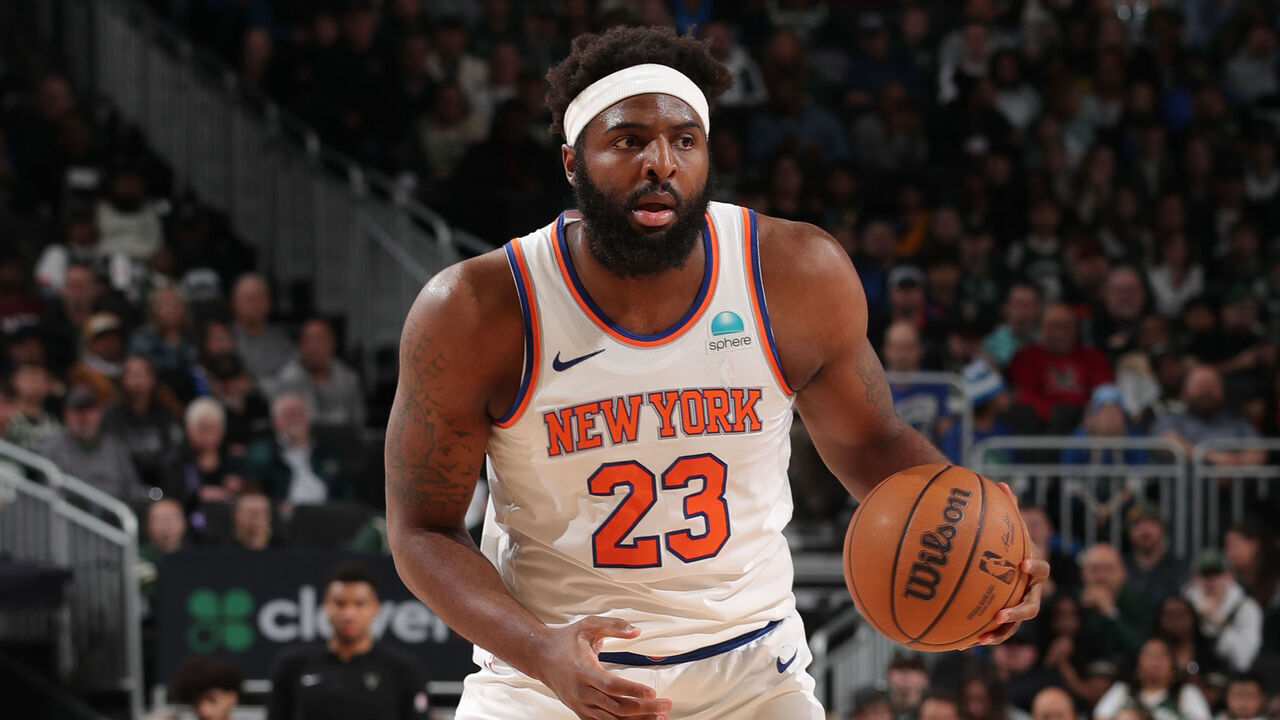 MILWAUKEE, WI - APRIL 7: Mitchell Robinson #23 of the New York Knicks handles the ball during the game against the Milwaukee Bucks on April 7, 2024 at the Fiserv Forum Center in Milwaukee, Wisconsin. Mandatory Copyright Notice: Copyright 2024 NBAE .