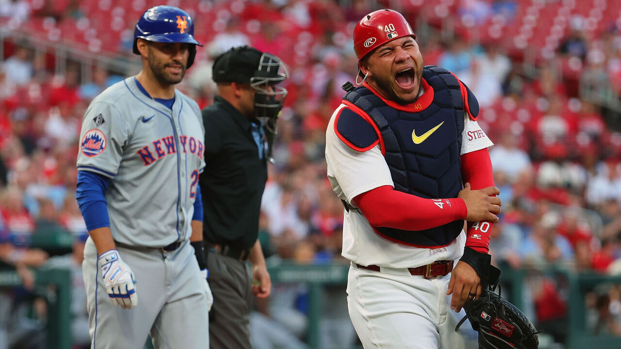 ST LOUIS, MISSOURI - MAY 7: Willson Contreras #40 of the St. Louis Cardinals reacts after getting hit by a bat on a follow through of the swing of J.D. Martinez #28 of the New York Mets in the second inning at Busch Stadium on May 7, 2024 in St Louis, Missouri. Contreras broke his arm on the play.
