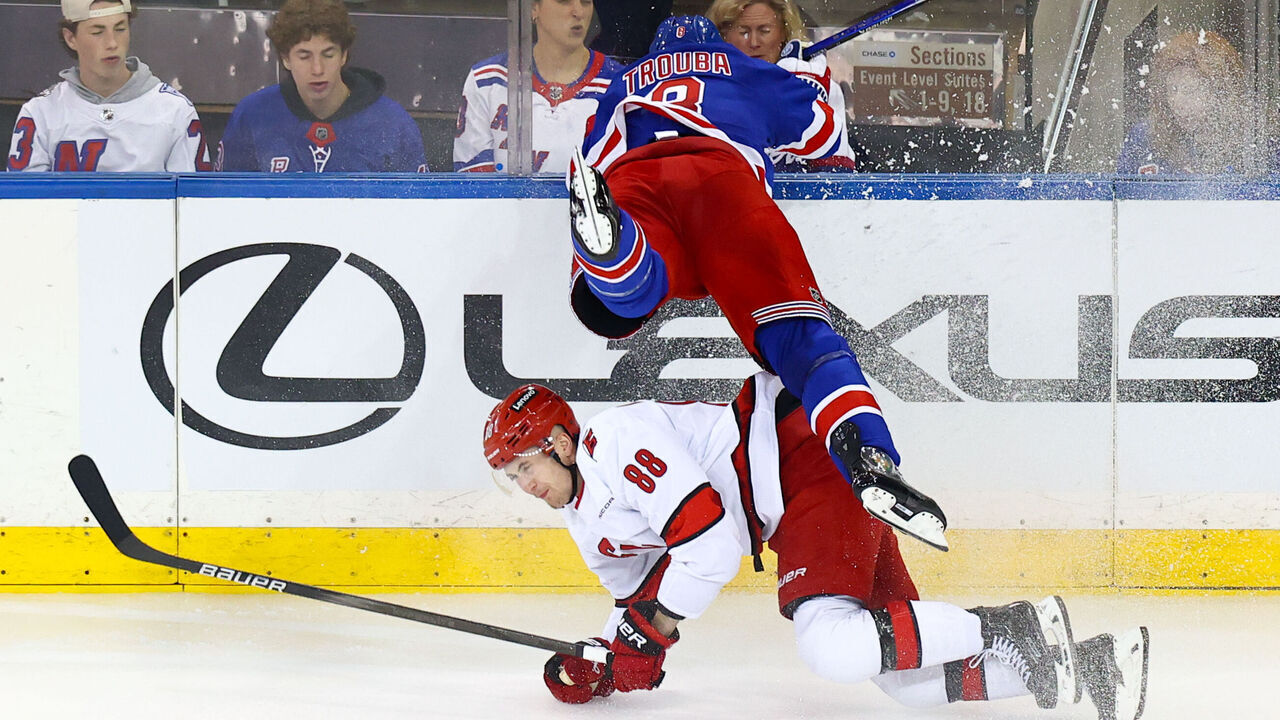 NEW YORK, NY - MAY 07: New York Rangers Defenseman Jacob Trouba (8) slams head-first into the glass during the first overtime in Game 2 of the National Hockey League Stanley Cup Playoffs Eastern Conference Second Round game between the Carolina Hurricanes and the New York Rangers on May 7, 2024 at Madison Square Garden in New York, NY.