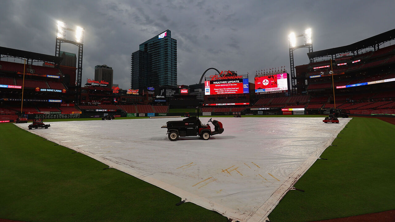 ST LOUIS, MISSOURI - MAY 8: Due to inclement weather, a tarp covers the field at a postponed game between the St. Louis Cardinals and the New York Mets at Busch Stadium on May 8, 2024 in St Louis, Missouri.