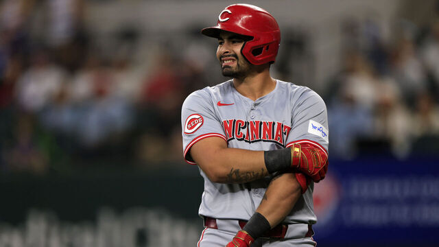 ARLINGTON, TX - APRIL 27: Christian Encarnacion-Strand #33 of the Cincinnati Reds reacts after being hit by a pitch against the Texas Rangers during the second inning at Globe Life Field on April 27, 2024 in Arlington, Texas.