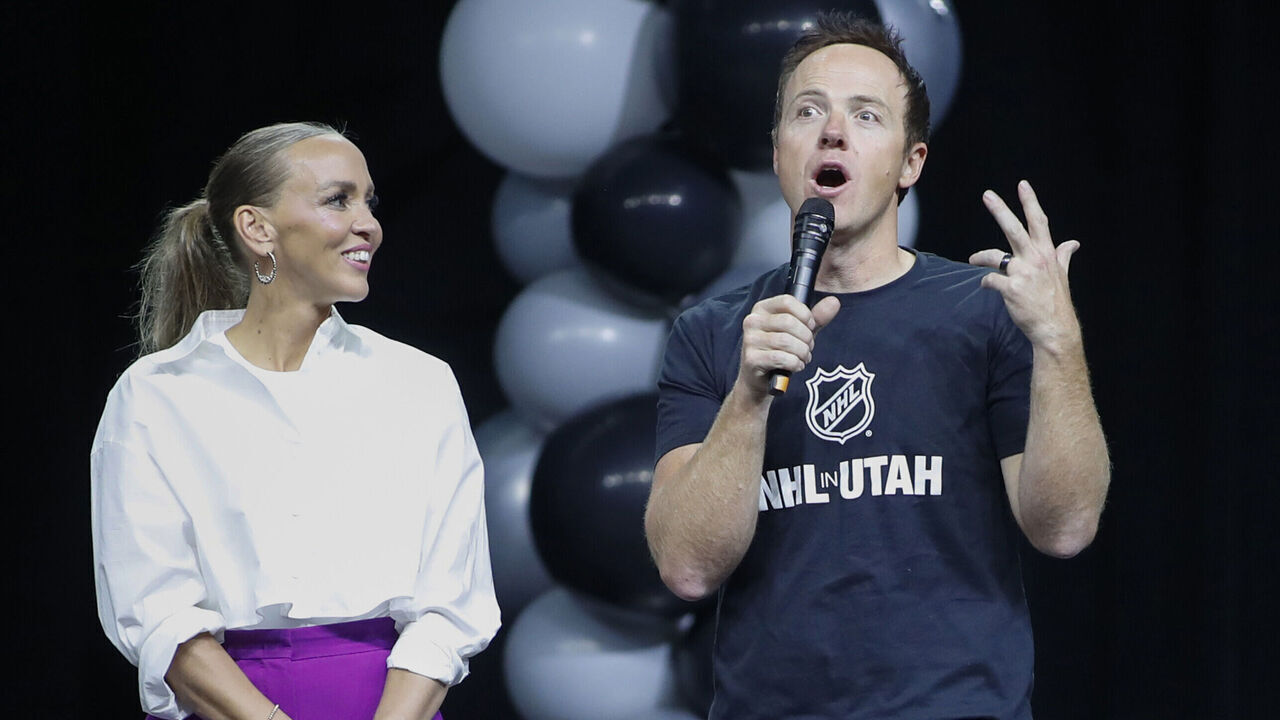 SALT LAKE CITY, UT - APRIL 24: (L-R) Team owners Ashley and Ryan Smith of the yet to be named NHL Utah hockey team speak before the players are introduced to the fans at the Delta Center on April 24, 2024 in Salt Lake City, Utah. The NHL has allowed the sale of the Arizona Coyotes and the team will relocate to Salt Lake City, Utah.