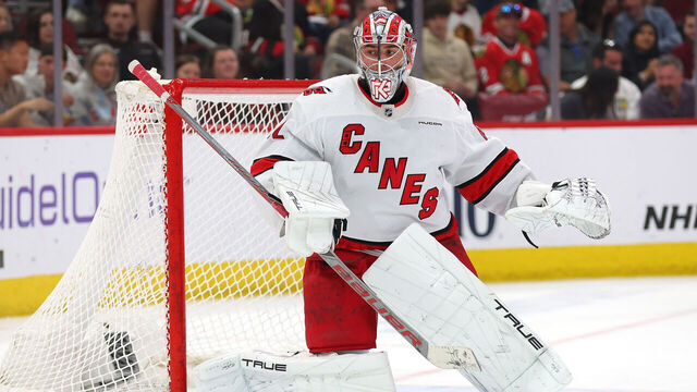 CHICAGO, ILLINOIS - APRIL 14: Pyotr Kochetkov #52 of the Carolina Hurricanes tends the net against the Chicago Blackhawks during the first period at the United Center on April 14, 2024 in Chicago, Illinois.