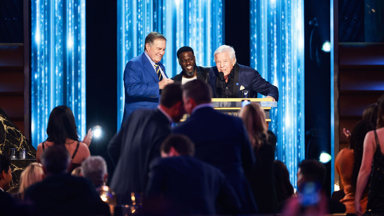 INGLEWOOD, CALIFORNIA - MAY 05: (L-R) Bill Belichick, Kevin Hart and Robert Kraft speak onstage during G.R.O.A.T The Greatest Roast Of All Time: Tom Brady for the Netflix is a Joke Festival at The Kia Forum on May 05, 2024 in Inglewood, California.