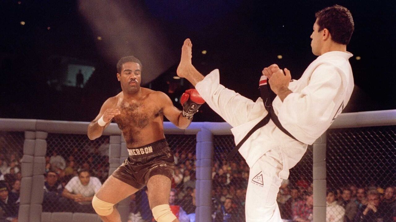 Jiu-Jitsu black belt Royce Gracie kicks at cruiserweight boxer Art Jimmerson during a 1st round match in the Ultimate Fighter Championships in Denver, Colorado. Gracie went on to win the match and eventually the championship. Mandatory Credit: Markus Boes