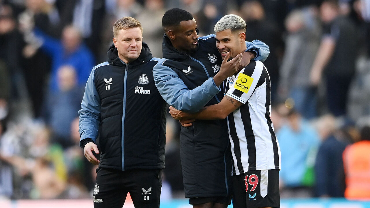 NEWCASTLE UPON TYNE, ENGLAND - APRIL 02: Alexander Isak congratulates teammate Bruno Guimaraes of Newcastle United whilst Eddie Howe, Manager of Newcastle United, looks on following the Premier League match between Newcastle United and Manchester United at St. James Park on April 02, 2023 in Newcastle upon Tyne, England.