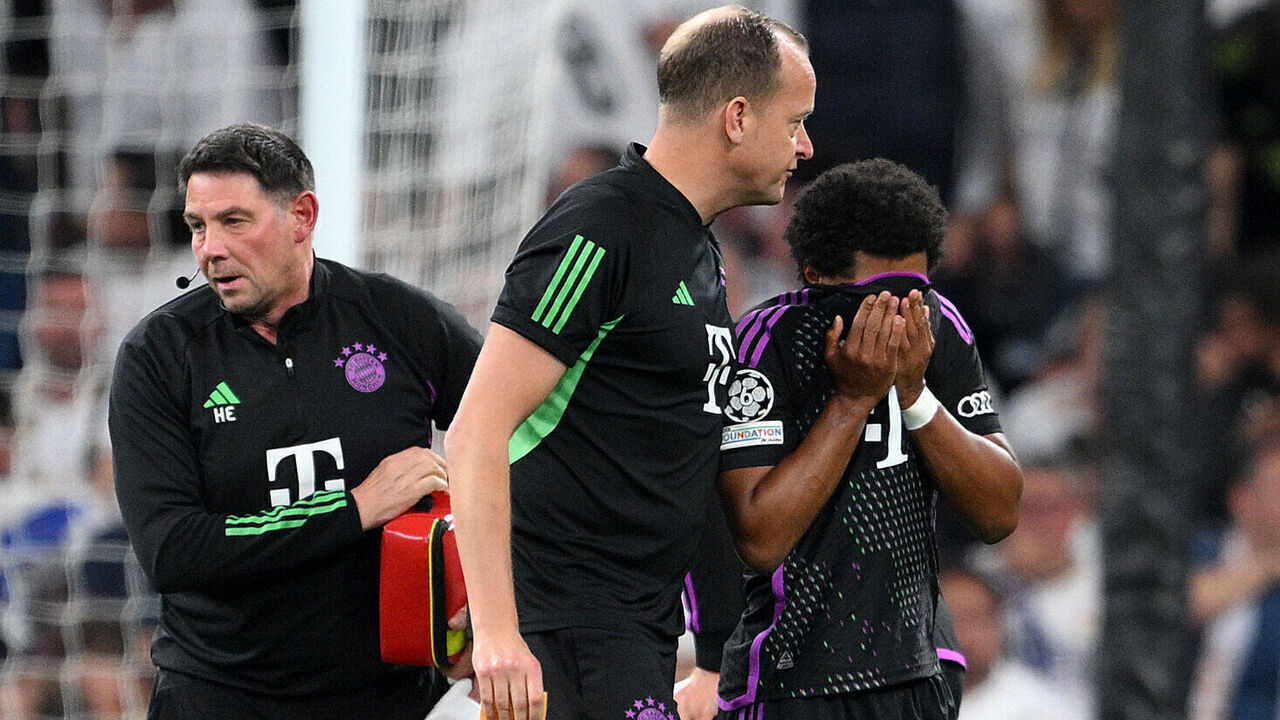 MADRID, SPAIN - MAY 08: Serge Gnabry of Bayern Munich receives medical treatment before being substituted off during the UEFA Champions League semi-final second leg match between Real Madrid and FC Bayern München at Estadio Santiago Bernabeu on May 08, 2024 in Madrid, Spain.