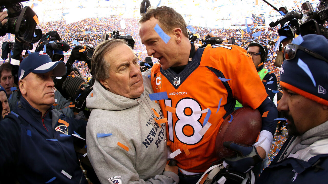 DENVER, CO - JANUARY 24: Peyton Manning #18 of the Denver Broncos and head coach Bill Belichick of the New England Patriots speak after the AFC Championship game at Sports Authority Field at Mile High on January 24, 2016 in Denver, Colorado. The Broncos defeated the Patriots 20-18.