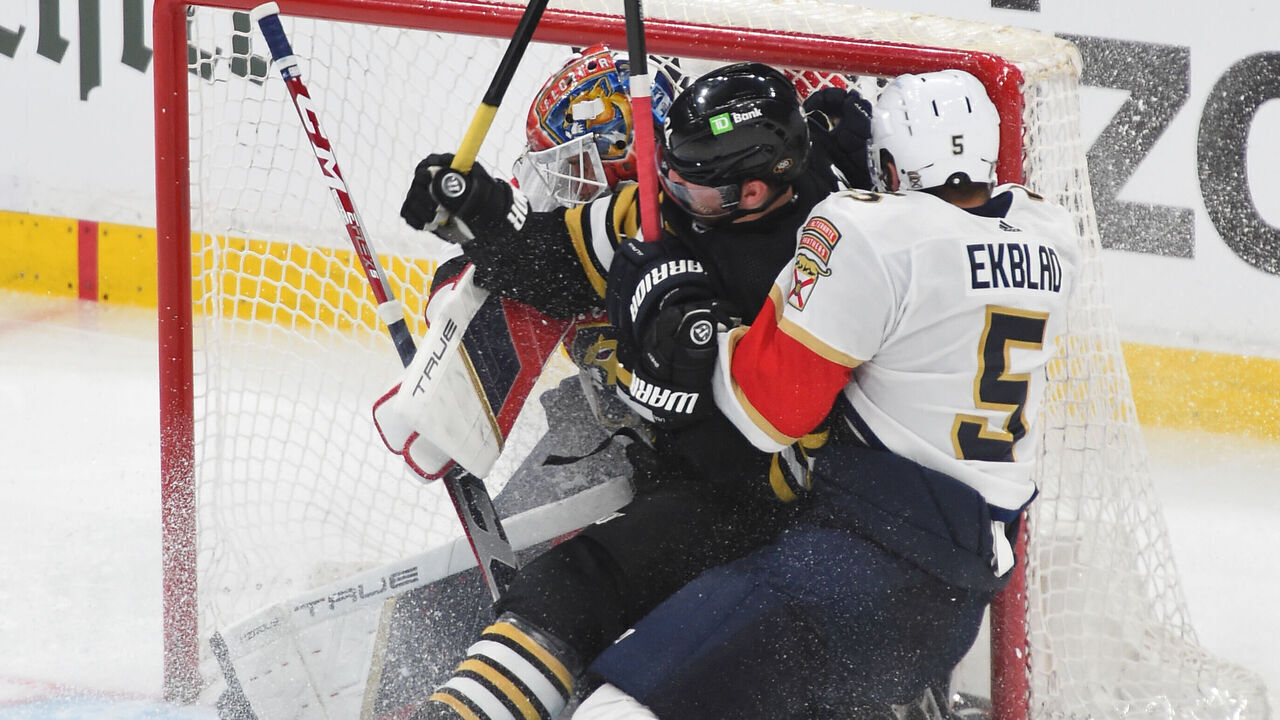 BOSTON, MASSACHUSETTS - MAY 10: Jakub Lauko #94 of the Boston Bruins collides into Sergei Bobrovsky #72 and Aaron Ekblad #5 of the Florida Panthers in Game Three of the Second Round of the 2024 Stanley Cup Playoffs at the TD Garden on May 10, 2024 in Boston, Massachusetts.