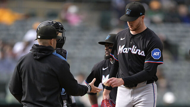 OAKLAND, CALIFORNIA - MAY 04: Manager Skip Schumaker #45 of the Miami Marlins takes the ball from starting pitcher Trevor Rogers #28 taking Rogers out of the game against the Oakland Athletics in the bottom of the third inning on May 4, 2024 at the Oakland Coliseum in Oakland, California.