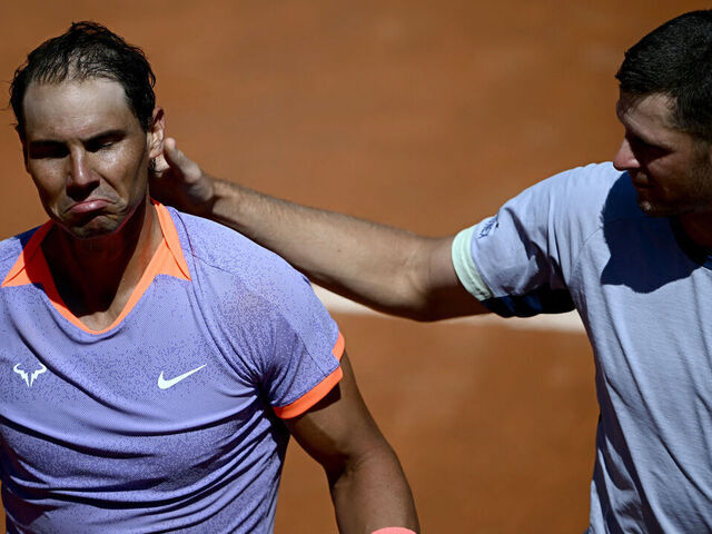 TOPSHOT - Spain's Rafael Nadal (L) looks dejected after being eliminated by Poland's Hubert Hurkacz during the Men's ATP Rome Open tennis tournament at Foro Italico in Rome on May 11, 2024.