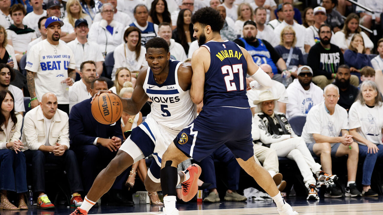 MINNEAPOLIS, MINNESOTA - MAY 12: Anthony Edwards #5 of the Minnesota Timberwolves drives to the basket against Jamal Murray #27 of the Denver Nuggets during the second quarter in Game Four of the Western Conference Second Round Playoffs at Target Center on May 12, 2024 in Minneapolis, Minnesota.