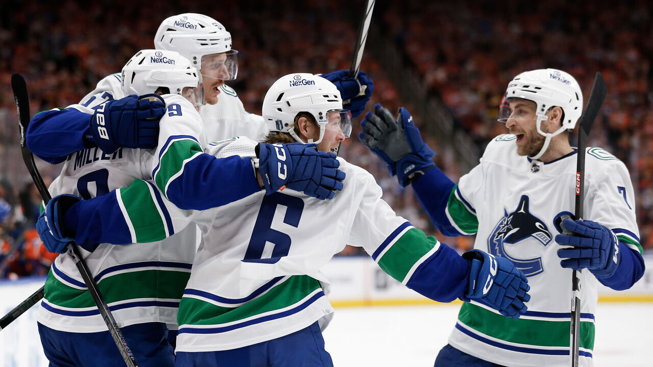 EDMONTON, ALBERTA - MAY 12: Brock Boeser #6 of the Vancouver Canucks celebrates with teammates after a hat trick during the first period against the Edmonton Oilers in Game Three of the Second Round of the 2024 Stanley Cup Playoffs at Rogers Place on May 12, 2024 in Edmonton, Alberta.