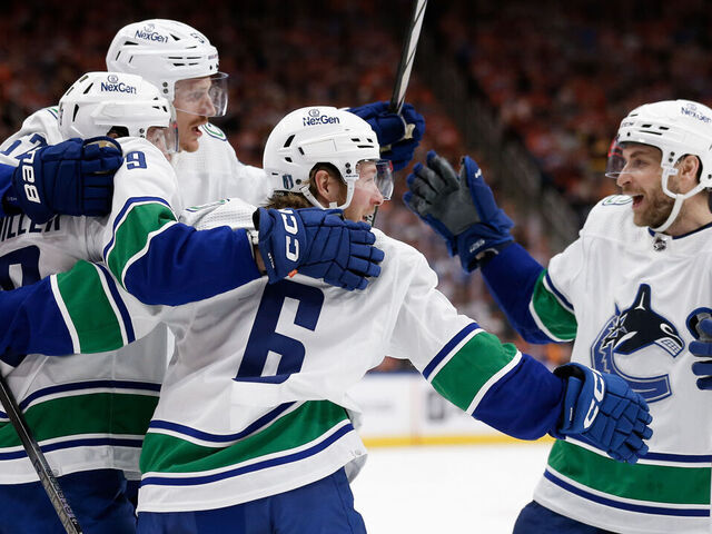 EDMONTON, ALBERTA - MAY 12: Brock Boeser #6 of the Vancouver Canucks celebrates with teammates after a hat trick during the first period against the Edmonton Oilers in Game Three of the Second Round of the 2024 Stanley Cup Playoffs at Rogers Place on May 12, 2024 in Edmonton, Alberta.