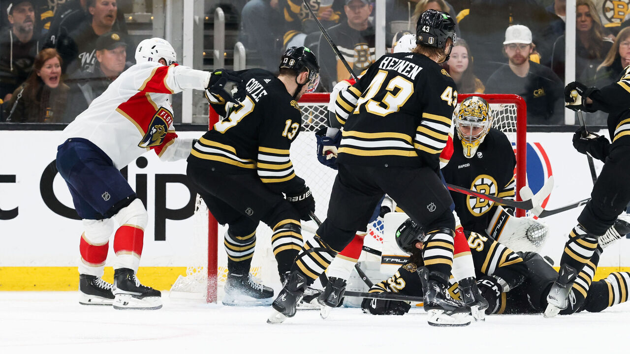 BOSTON, MASSACHUSETTS - MAY 12: Sam Bennett #9 of the Florida Panthers cross-checks Charlie Coyle #13 of the Boston Bruins into Jeremy Swayman #1 moments before he scored against the Boston Bruins in Game Four of the Second Round of the 2024 Stanley Cup Playoffs at the TD Garden on May 12, 2024 in Boston, Massachusetts. The Panthers won 3-2.