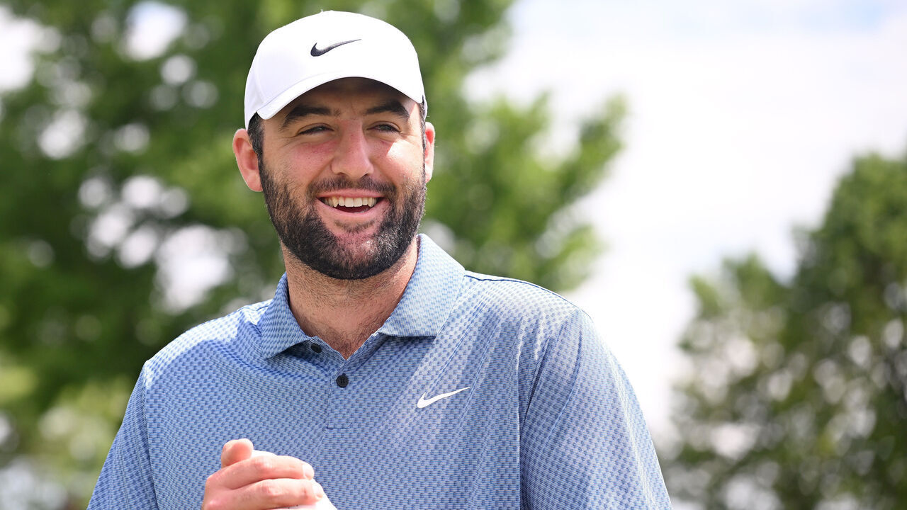 LOUISVILLE, KENTUCKY - MAY 13: Scottie Scheffler of the United States smiles on the practice putting green during a practice round prior to the 2024 PGA Championship at Valhalla Golf Club on May 13, 2024 in Louisville, Kentucky.