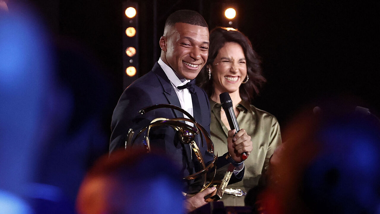 Paris Saint-Germain's French forward #07 Kylian Mbappe delivers a speech after receiving the Best Players Ligue 1 Award at the end of the TV show at the UNFP (French National Professional Football players Union) trophy ceremony, in Paris on May 13, 2024.
