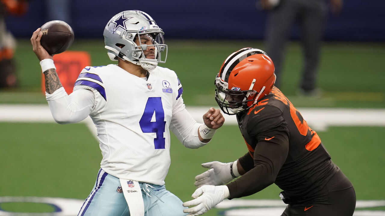 ARLINGTON, TEXAS - OCTOBER 04: Myles Garrett #95 of the Cleveland Browns sacks Dak Prescott #4 of the Dallas Cowboys during an NFL game against the Dallas Cowboys on October 4, 2020 in Arlington, Texas.