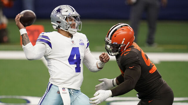 ARLINGTON, TEXAS - OCTOBER 04: Myles Garrett #95 of the Cleveland Browns sacks Dak Prescott #4 of the Dallas Cowboys during an NFL game against the Dallas Cowboys on October 4, 2020 in Arlington, Texas.