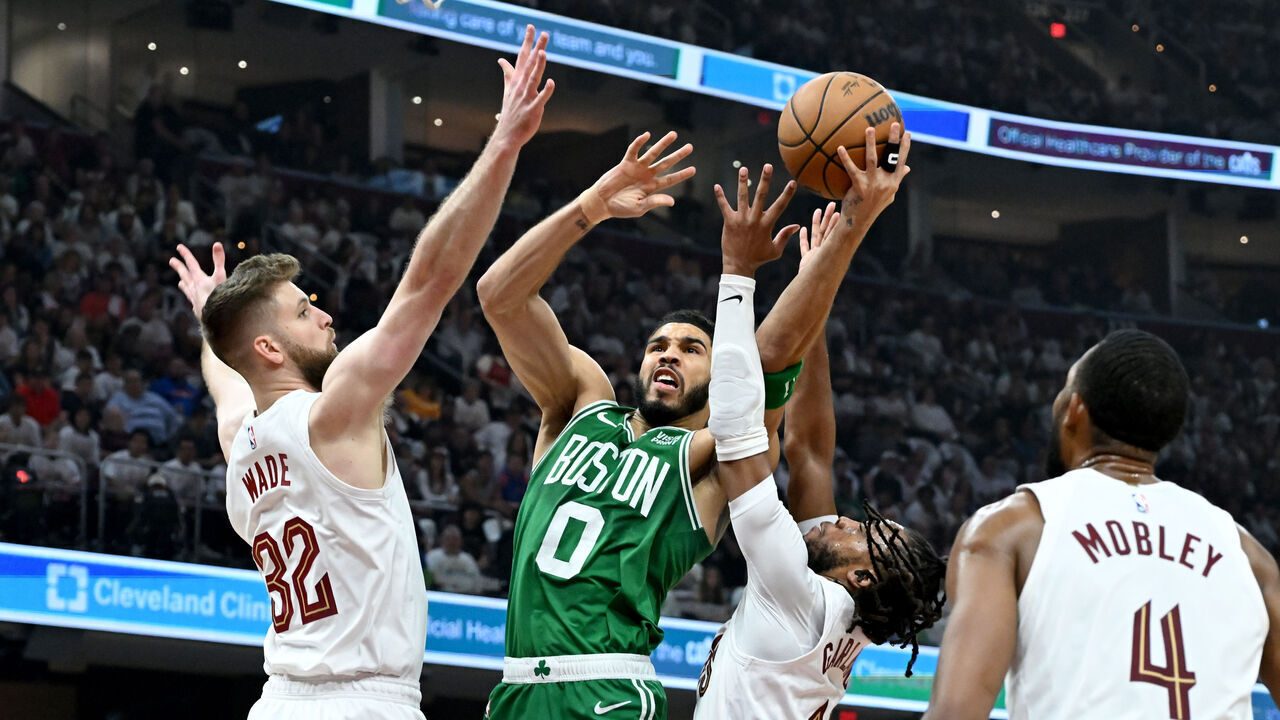 CLEVELAND, OHIO - MAY 13: Jayson Tatum #0 of the Boston Celtics drives to the basket over Dean Wade #32 and Darius Garland #10 of the Cleveland Cavaliers in Game Four of the Eastern Conference Second Round Playoffs at Rocket Mortgage Fieldhouse on May 13, 2024 in Cleveland, Ohio.