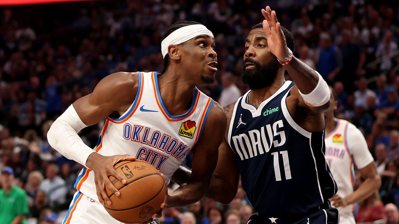 DALLAS, TEXAS - MAY 13: Kyrie Irving #11 of the Dallas Mavericks fouls Shai Gilgeous-Alexander #2 of the Oklahoma City Thunder during the third quarter in Game Four of the Western Conference Second Round Playoffs at American Airlines Center on May 13, 2024 in Dallas, Texas.