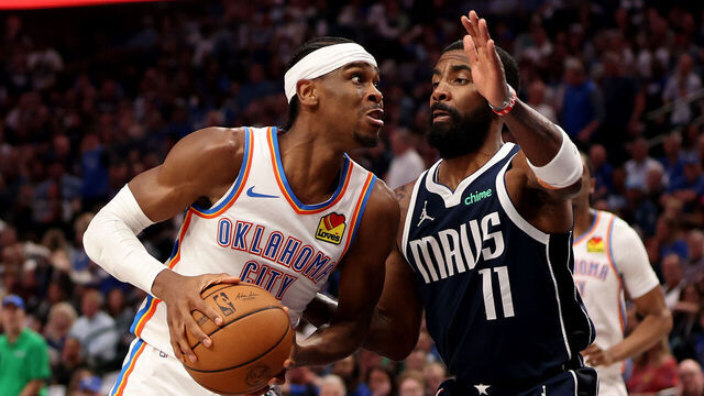 DALLAS, TEXAS - MAY 13: Kyrie Irving #11 of the Dallas Mavericks fouls Shai Gilgeous-Alexander #2 of the Oklahoma City Thunder during the third quarter in Game Four of the Western Conference Second Round Playoffs at American Airlines Center on May 13, 2024 in Dallas, Texas.