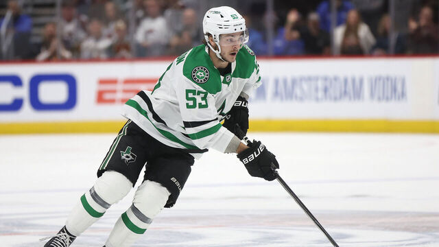 DENVER, COLORADO - MAY 13: Wyatt Johnston #53 of the Dallas Stars advances the puck against the Colorado Avalanche in the first period during Game Four of the Second Round of the 2024 Stanley Cup Playoffs at Ball Arena on May 13, 2024 in Denver, Colorado.